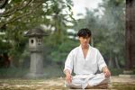 person-meditating-before-taekwondo-training_23-2149908468.jpg